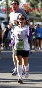 Wendy crossing the finish line at Rock N Roll race 2011