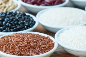 Raw rice and grains in bowls