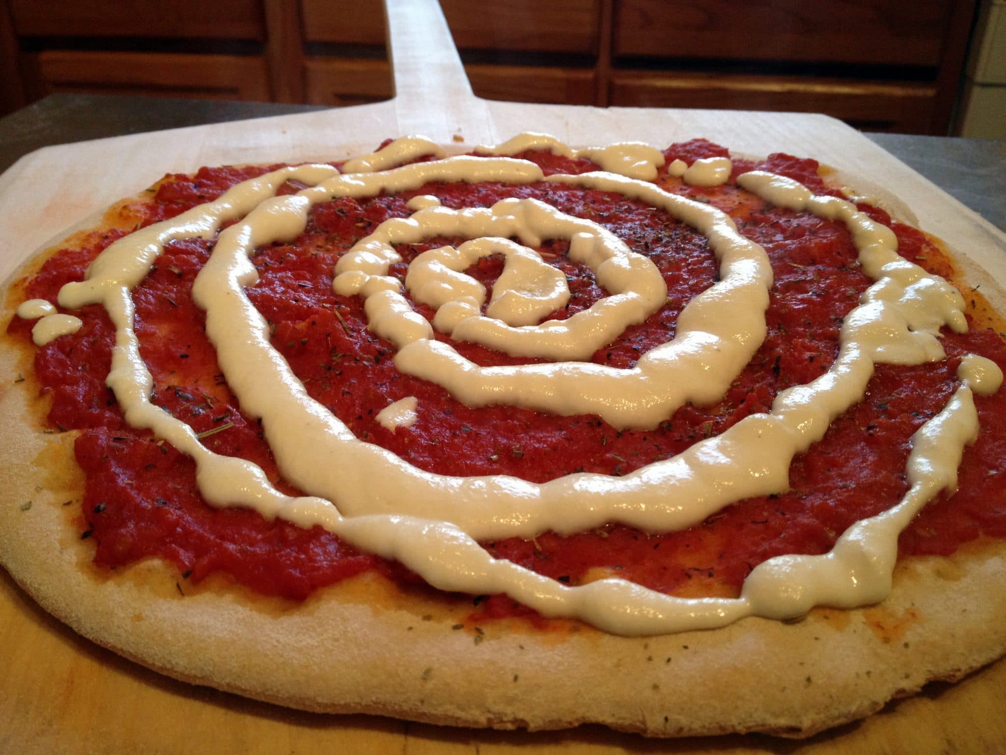 Preparing vegan cheese homemade from scratch pizza