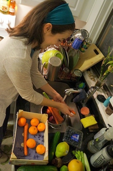 Woman prepping produce to be juiced