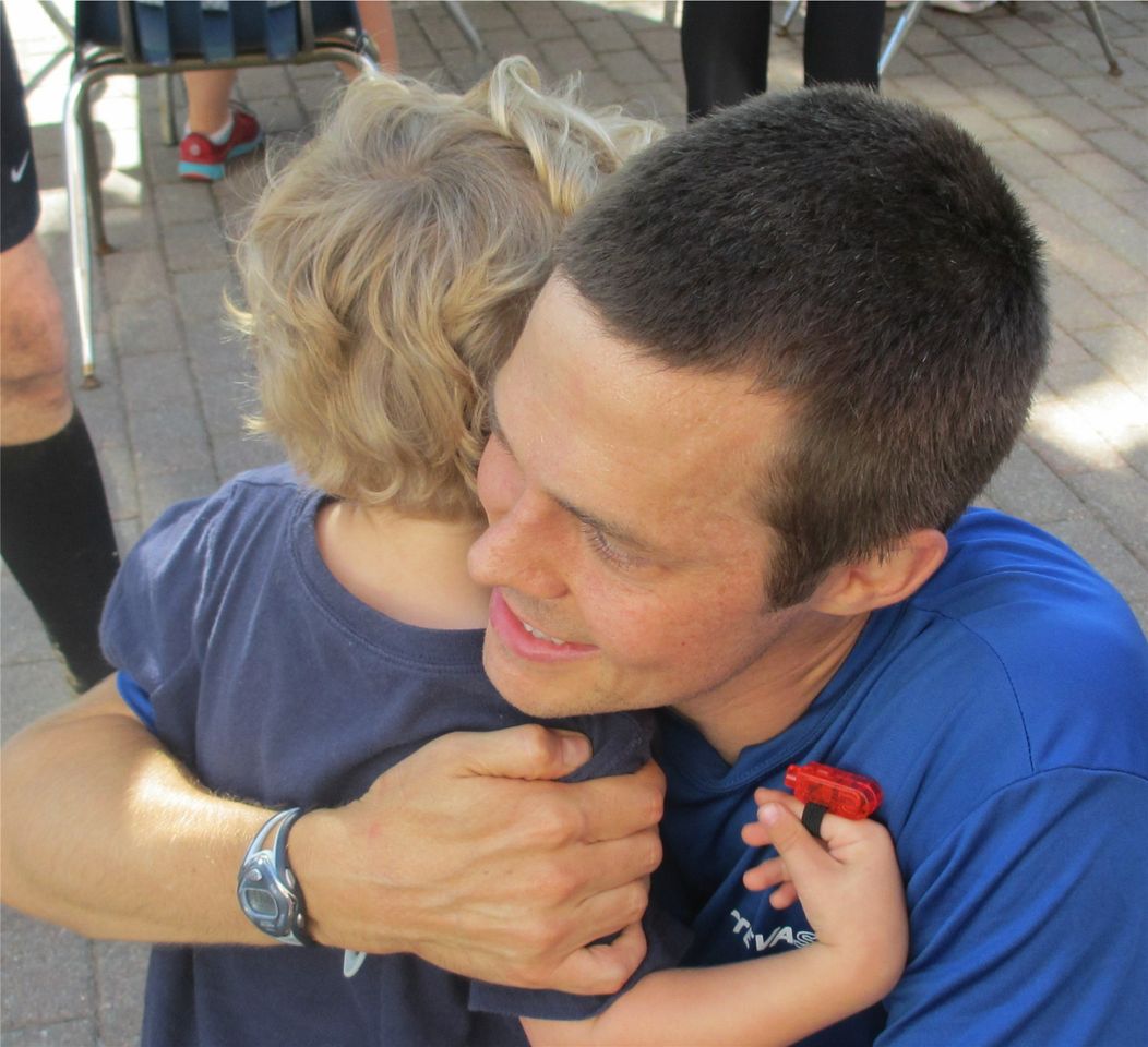 Matt hugging son after race