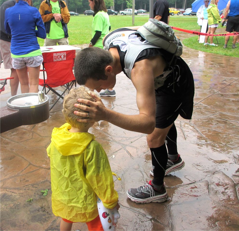 Matt saying goodbye to his son before running