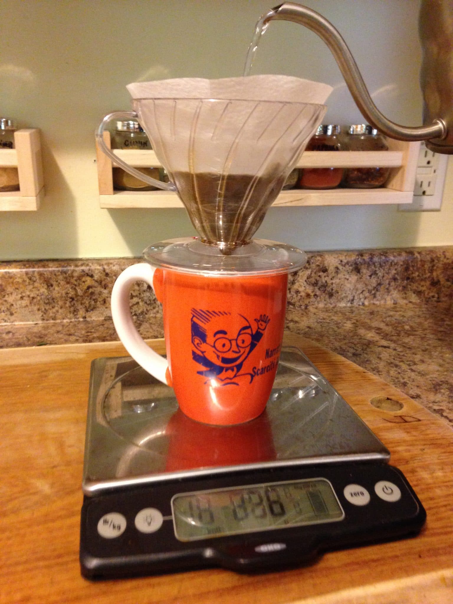 Making a pour over of coffee at home, on a scale, in the kitchen