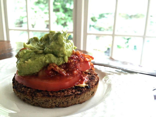 Veggie Burger topped with tomato and guac