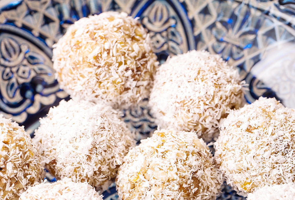 pumpkin spice and date protein balls with cocnut flakes
